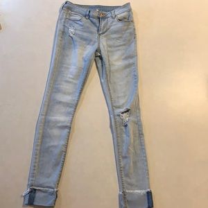 Light wash denim ripped skinny jeans. From Belk.